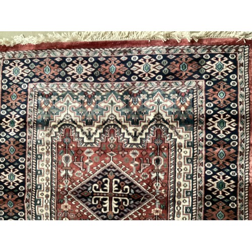 356 - Kashmir silk rug with central three diamond and birds pattern and blue pattern border. Main  colours... 