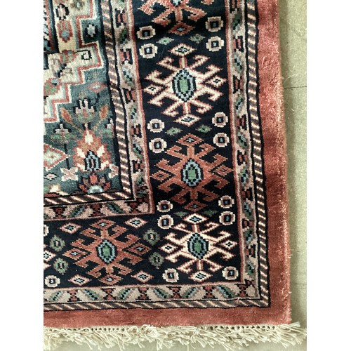 356 - Kashmir silk rug with central three diamond and birds pattern and blue pattern border. Main  colours... 