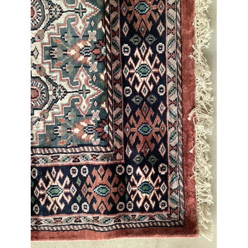 356 - Kashmir silk rug with central three diamond and birds pattern and blue pattern border. Main  colours... 