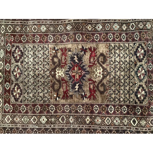 357 - Afghan handmade silk rug, central pattern with four “dragons “ and with three geometric patterned bo... 