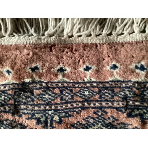 359 - Large Persian style rug with geometric central pattern and borders, main colours are pink and blues,... 