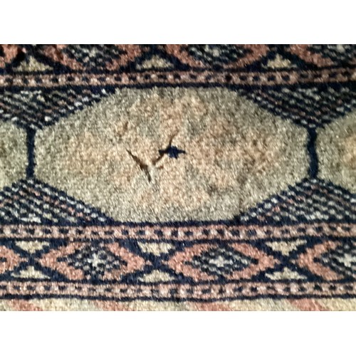 359 - Large Persian style rug with geometric central pattern and borders, main colours are pink and blues,... 