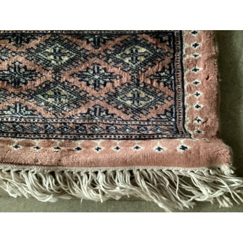 359 - Large Persian style rug with geometric central pattern and borders, main colours are pink and blues,... 