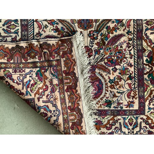 360 - Persian rug, central pattern of flower vases and weeping women and ornate borders with birds. Colour... 