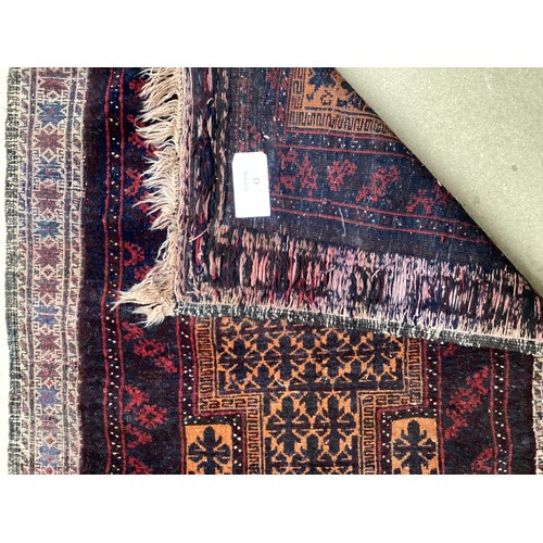 363 - Wool handmade rug with central pattern and borders and reverse stitched outer border. Main colours a... 