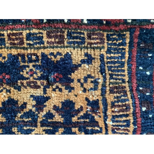 363 - Wool handmade rug with central pattern and borders and reverse stitched outer border. Main colours a... 