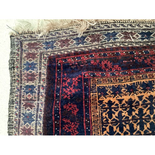 363 - Wool handmade rug with central pattern and borders and reverse stitched outer border. Main colours a... 