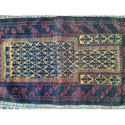 363 - Wool handmade rug with central pattern and borders and reverse stitched outer border. Main colours a... 