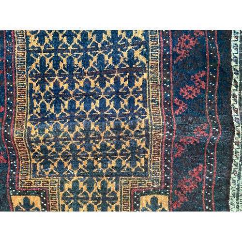 363 - Wool handmade rug with central pattern and borders and reverse stitched outer border. Main colours a... 