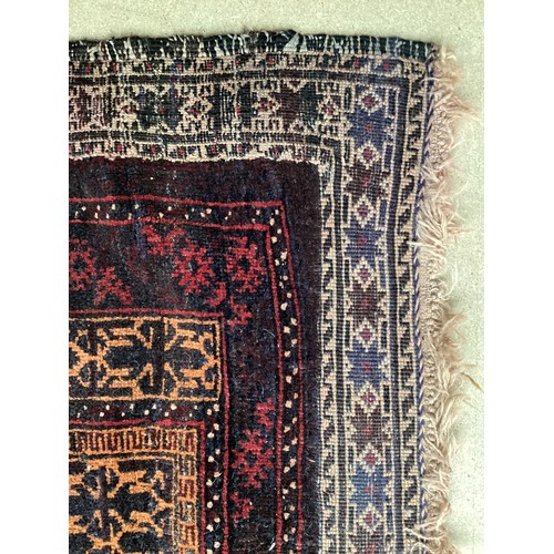 363 - Wool handmade rug with central pattern and borders and reverse stitched outer border. Main colours a... 