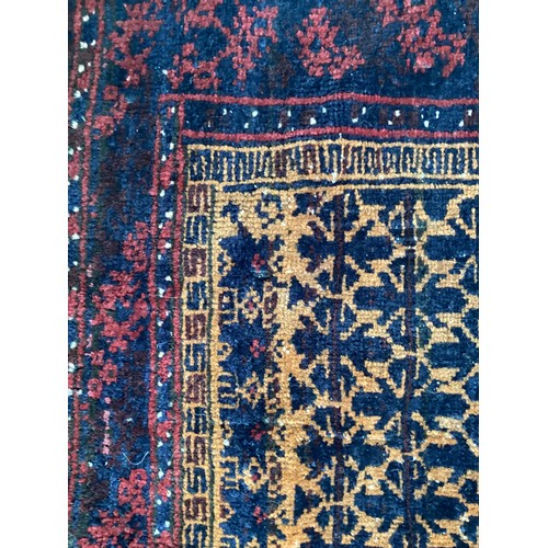 363 - Wool handmade rug with central pattern and borders and reverse stitched outer border. Main colours a... 