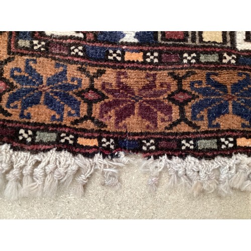 365 - Wool handmade rug, depicting temples and border. Main colours are brown, cream blues, 80-82cm x 131.... 