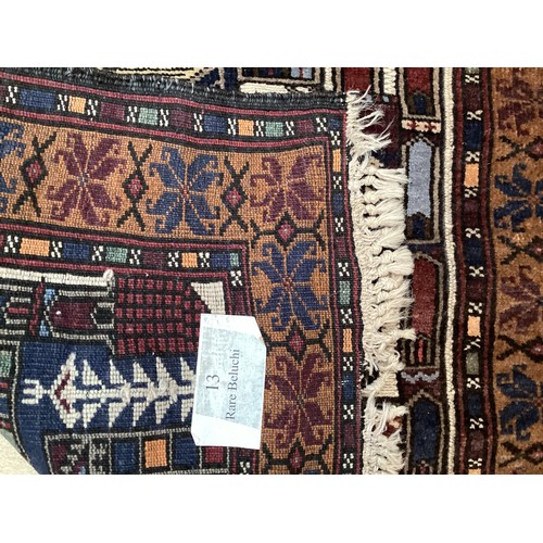 365 - Wool handmade rug, depicting temples and border. Main colours are brown, cream blues, 80-82cm x 131.... 