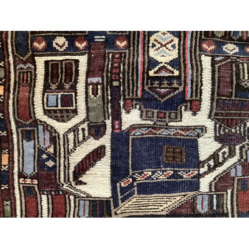 365 - Wool handmade rug, depicting temples and border. Main colours are brown, cream blues, 80-82cm x 131.... 