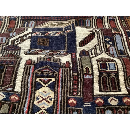 365 - Wool handmade rug, depicting temples and border. Main colours are brown, cream blues, 80-82cm x 131.... 