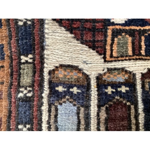 365 - Wool handmade rug, depicting temples and border. Main colours are brown, cream blues, 80-82cm x 131.... 