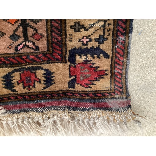 366 - Wool handmade rug with central pattern depicting a temple and border. Main colours are brown, orange... 