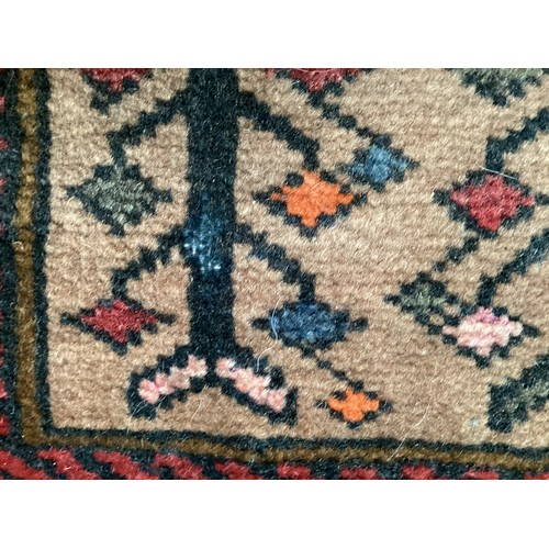 366 - Wool handmade rug with central pattern depicting a temple and border. Main colours are brown, orange... 