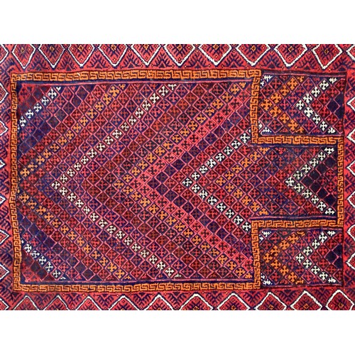 368 - Oriental wool handmade rug with embossed central design and a border. Main colours are red, blue and... 