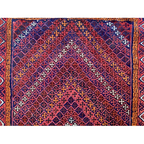 368 - Oriental wool handmade rug with embossed central design and a border. Main colours are red, blue and... 