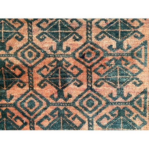 369 - Wool handmade rug with central pattern and border. Main colours are orange and brown. Condition- few... 