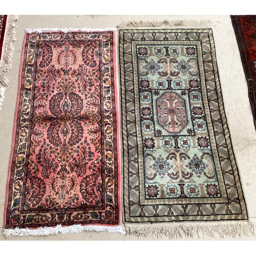 370 - Oriental wool rug with central pattern and border, pink background with blues, cream and yellow. Gen... 