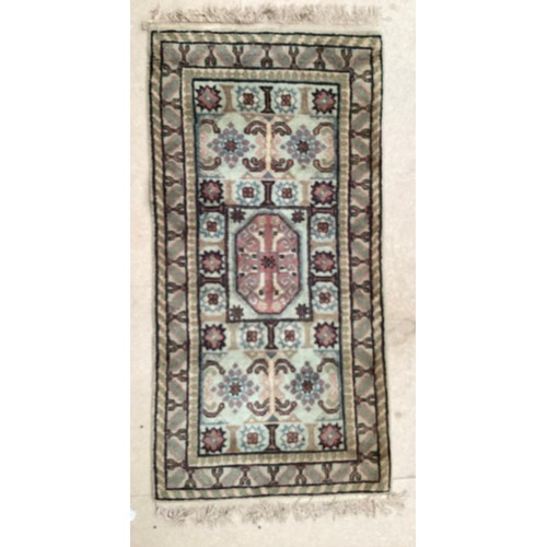 370 - Oriental wool rug with central pattern and border, pink background with blues, cream and yellow. Gen... 