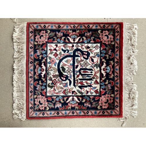 371 - Two similar small wool ? handmade oriental rugs , with central pattern of hieroglyphics symbols and ... 