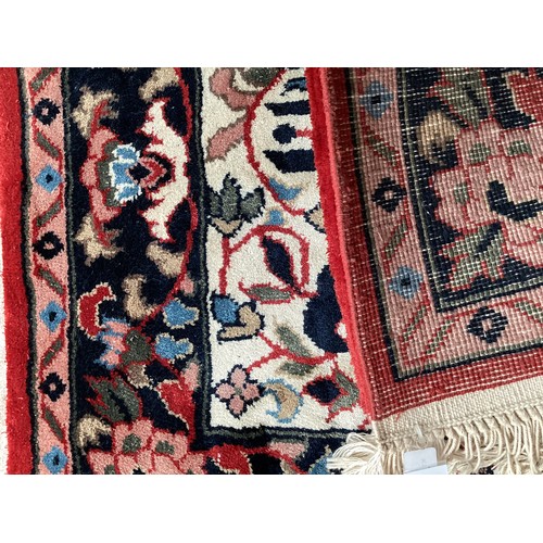 371 - Two similar small wool ? handmade oriental rugs , with central pattern of hieroglyphics symbols and ... 