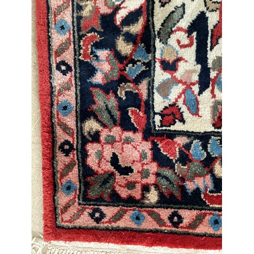 371 - Two similar small wool ? handmade oriental rugs , with central pattern of hieroglyphics symbols and ... 