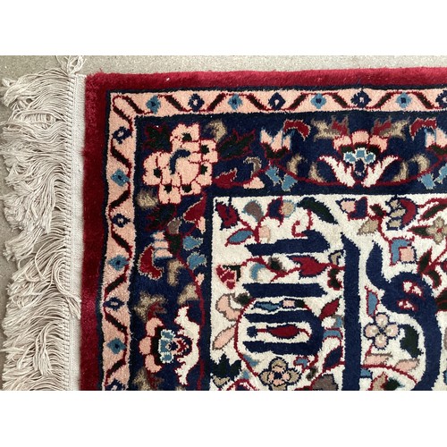 371 - Two similar small wool ? handmade oriental rugs , with central pattern of hieroglyphics symbols and ... 