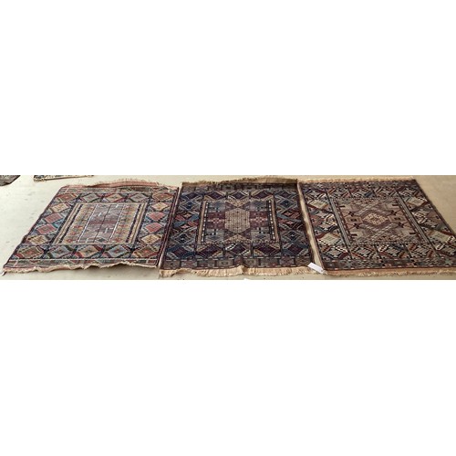 373 - Three similar wool rugs, see photos for details. Wear commensurate with age and use. Largest 116 cm ... 