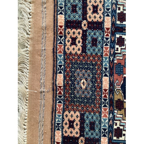 373 - Three similar wool rugs, see photos for details. Wear commensurate with age and use. Largest 116 cm ... 