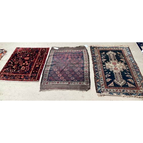 377 - Three small rugs, see photos for details, much wear to edges and all over wear commensurate with use... 