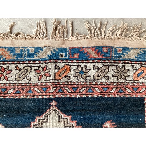 377 - Three small rugs, see photos for details, much wear to edges and all over wear commensurate with use... 