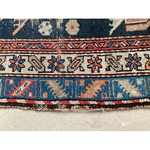 377 - Three small rugs, see photos for details, much wear to edges and all over wear commensurate with use... 