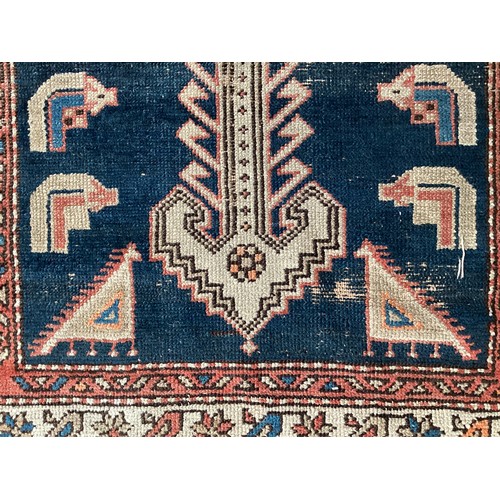 377 - Three small rugs, see photos for details, much wear to edges and all over wear commensurate with use... 