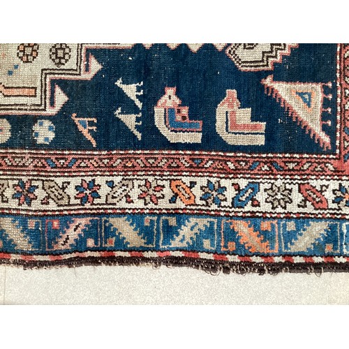 377 - Three small rugs, see photos for details, much wear to edges and all over wear commensurate with use... 