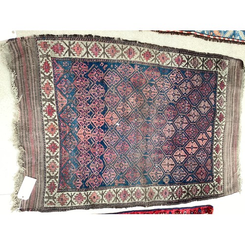 377 - Three small rugs, see photos for details, much wear to edges and all over wear commensurate with use... 