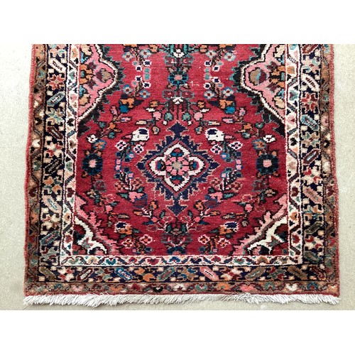 378 - Red ground runner, see photos for details, 96 cm x 297 cm, condition all over wear.