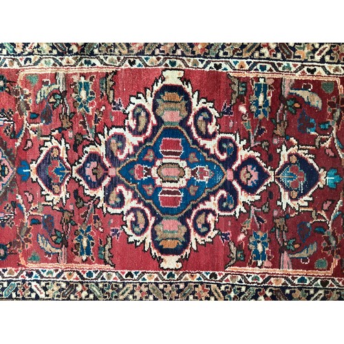 378 - Red ground runner, see photos for details, 96 cm x 297 cm, condition all over wear.