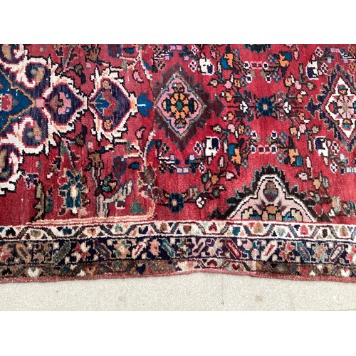 378 - Red ground runner, see photos for details, 96 cm x 297 cm, condition all over wear.