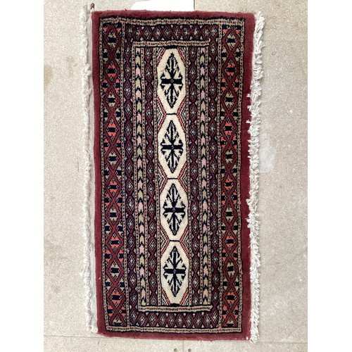 380 - Two small rugs and a shaped hanging/rug. (kurdish afghan hanger) All over wear to all. Rugs, 32 cm x... 