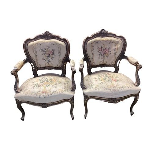 567 - Good Pair of Rococo armchairs with floral tapestry design. 90 cm H. Condition, losses and chips to p... 