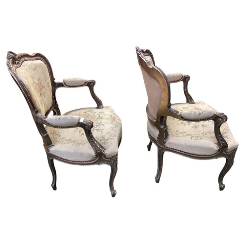 567 - Good Pair of Rococo armchairs with floral tapestry design. 90 cm H. Condition, losses and chips to p... 