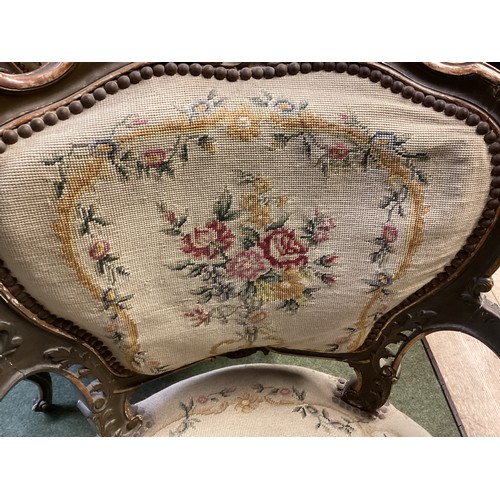 567 - Good Pair of Rococo armchairs with floral tapestry design. 90 cm H. Condition, losses and chips to p... 