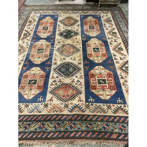 348 - large wool rug, 256cm x 340cm. In fair condition, a few stains, loss of pile, damage to the fringe