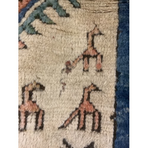 348 - large wool rug, 256cm x 340cm. In fair condition, a few stains, loss of pile, damage to the fringe