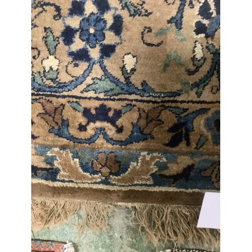 384 - A large Persian style blue ground rug, notable all over wear 255 cm x 404 cm