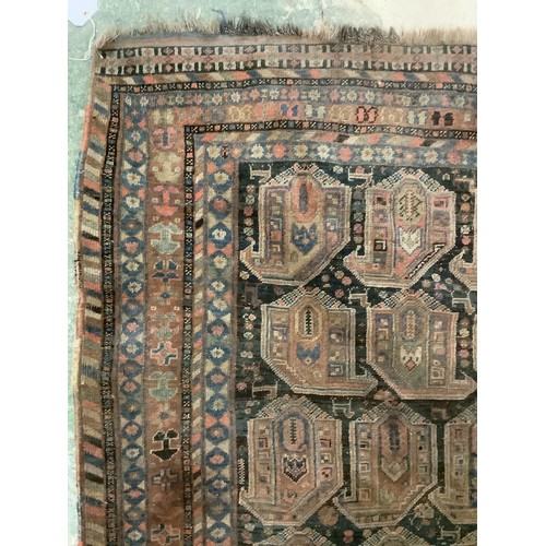 383 - A large Persian style carpet, with all over brown ground and geometric pattern and borders, and much... 